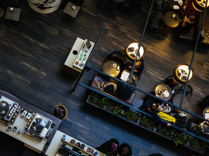 people, restaurant, coffee, shop, socialize, chill, relax, cafe, bartender, chair, table, lamp, light, wood, floor